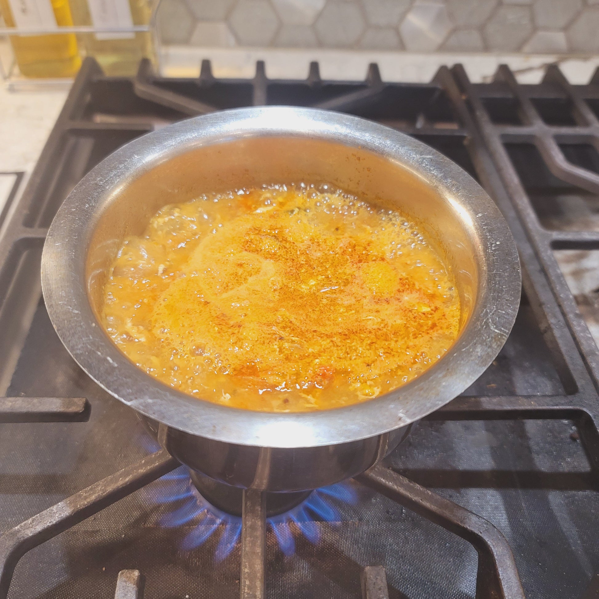 boiling sambar on stove