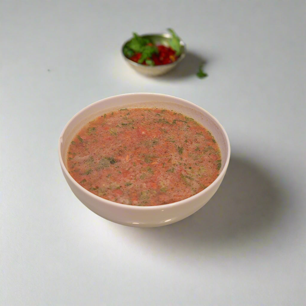 rasam in white bowl